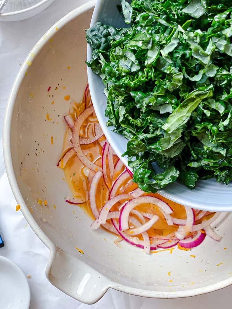 process shot of adding kale to bowl
