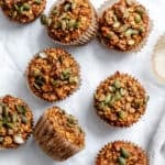 completed Pumpkin Oatmeal Muffins on a white surface