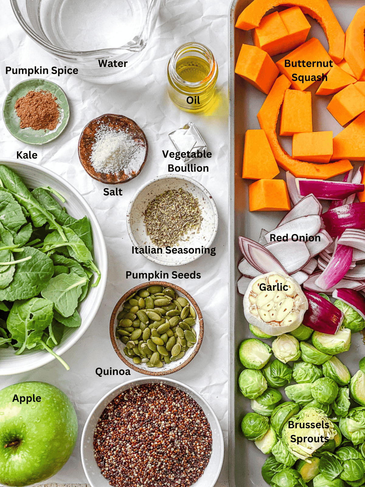 ingredients for Fall Quinoa Salad measured out on a white surface