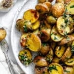 completed Garlic Roasted Baby Potatoes on a plate