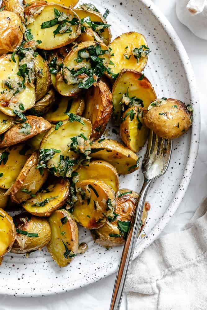 completed Garlic Roasted Baby Potatoes on a plate