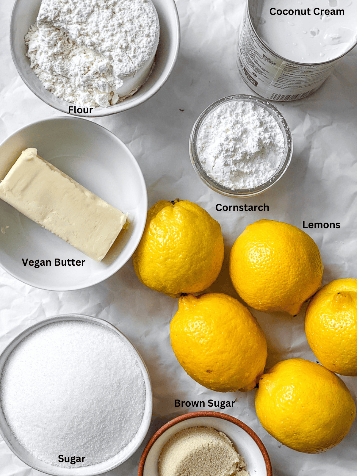 ingredients for Easy Vegan Lemon Bars on a white surface