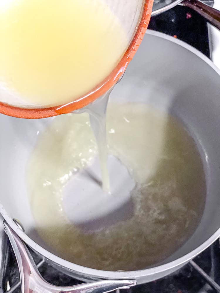 process shot showing lemon juice being added to bowl