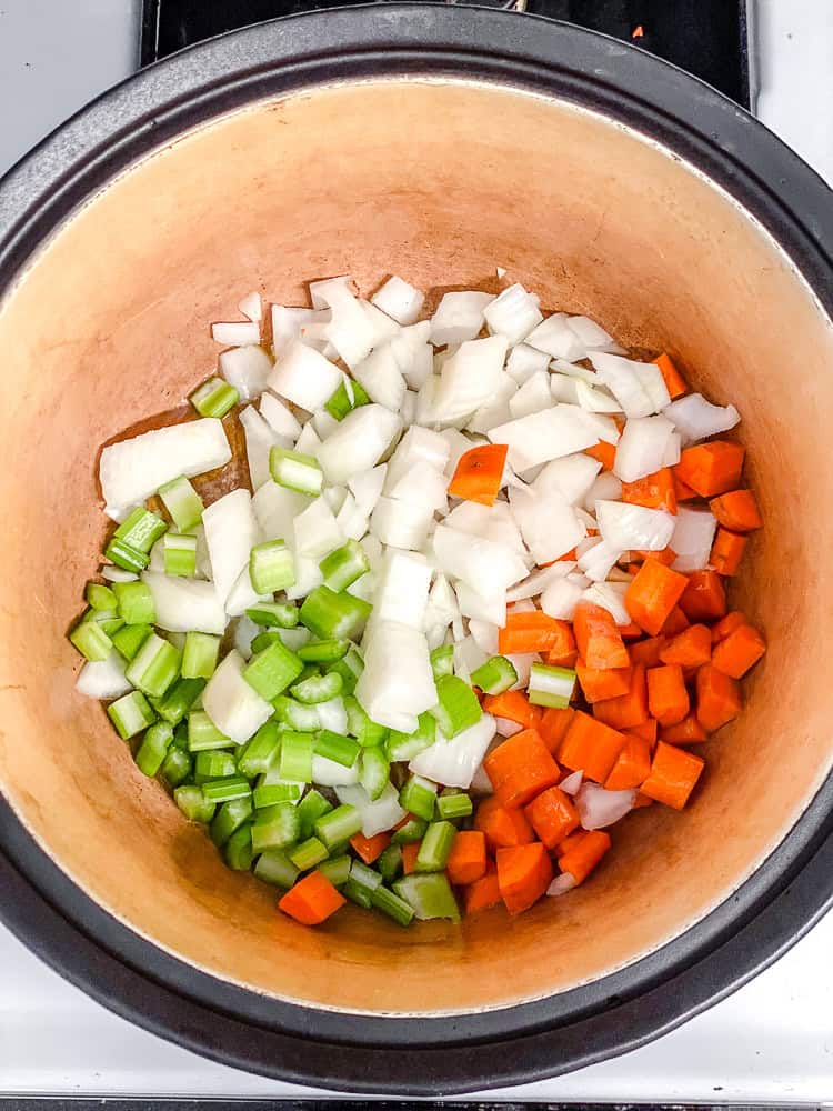 process shot of cooking soup ingredients in pot