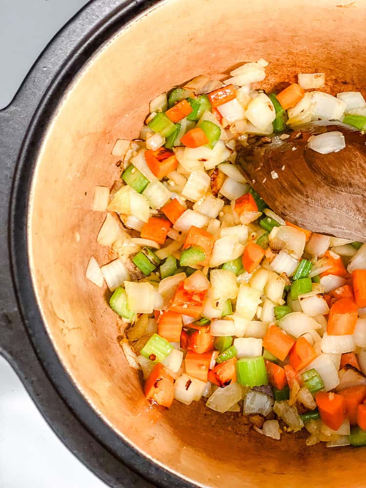 process shot of cooking soup ingredients in pot