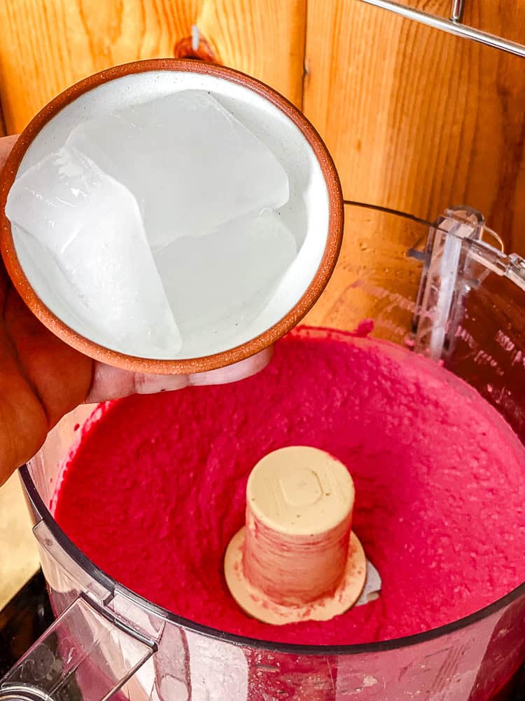 process shot showing adding ice to food processor