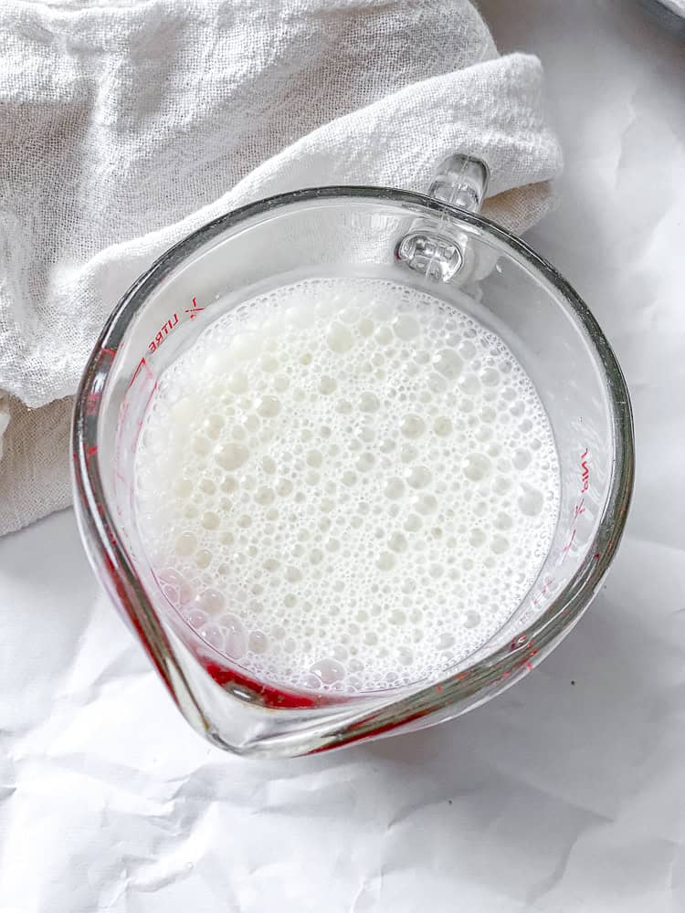 process shot showing vegan buttermilk in a bowl