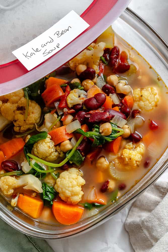 completed Kale Vegetable Bean Soup in a storage container