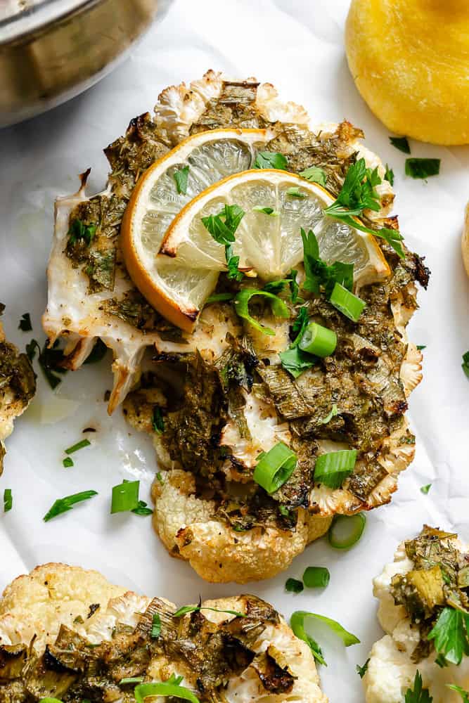 completed Roasted Cauliflower with Lemon and Herbs on a white surface