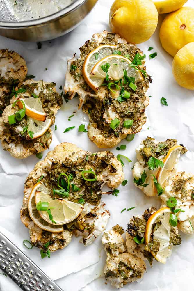 completed Roasted Cauliflower with Lemon and Herbs on a white surface