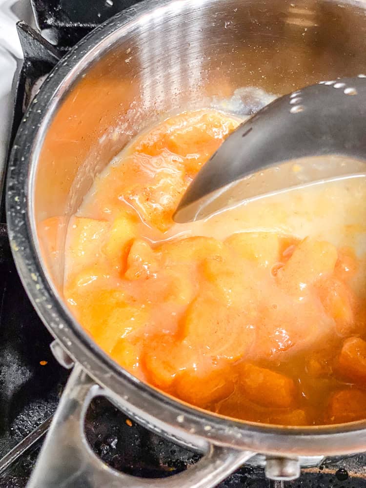 process shot showing stirring ingredients in pot