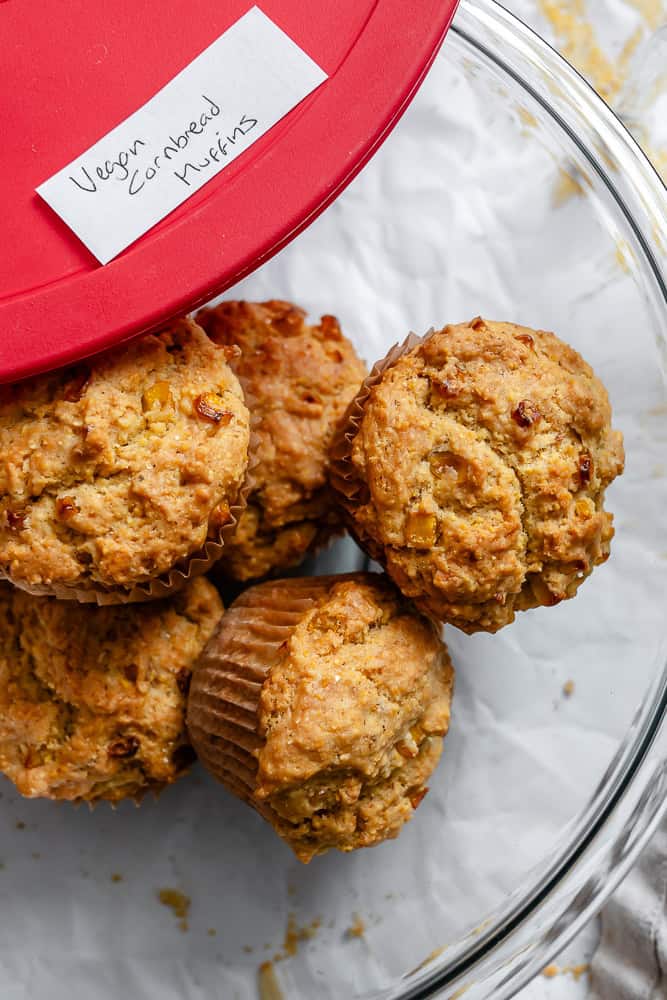 completed Vegan Cornbread Muffins in a storage container