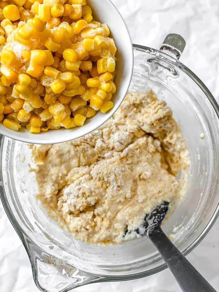 process shot showing adding corn to bowl