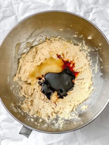 Wet ingredients for vegan gingerbread cookies added to a mixing bowl