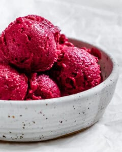 Bowl of purple mixed berry tofu ice cream.