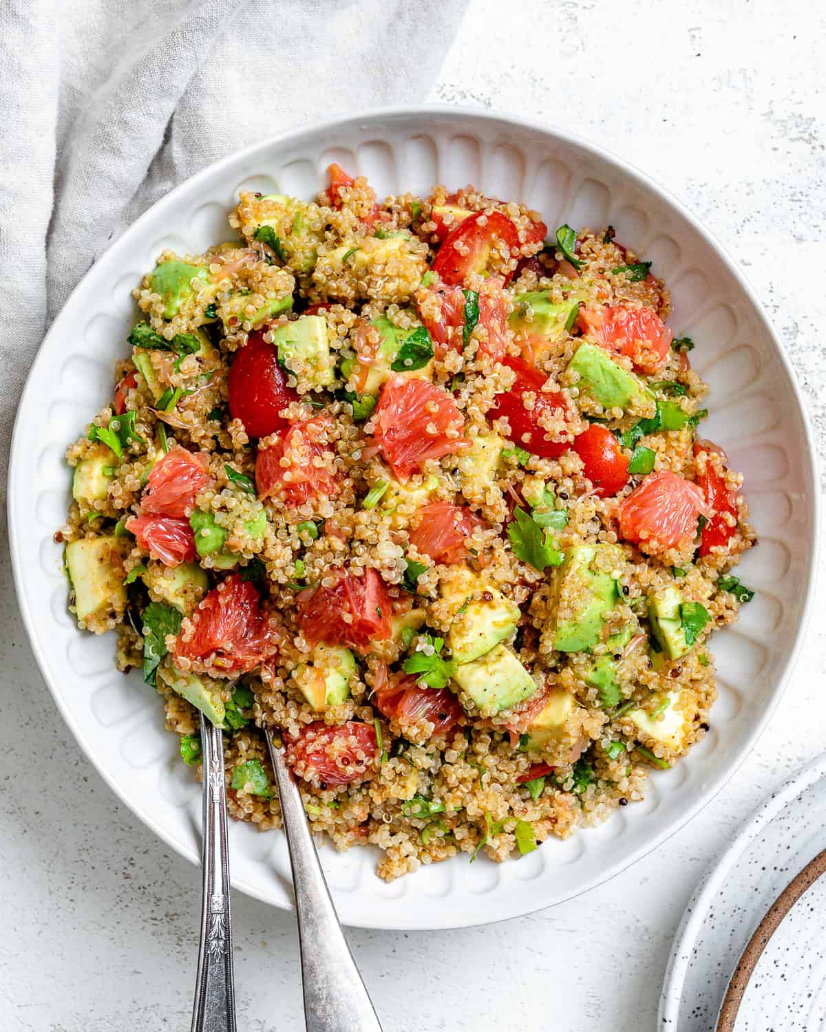 Completed Avocado Quinoa Salad [With Grapefruit] on a plate.