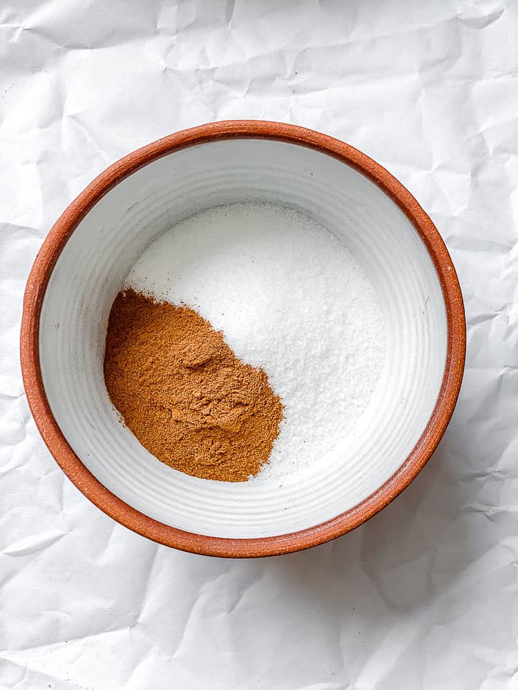 process shot showing sugar cinnamon topping in bowl