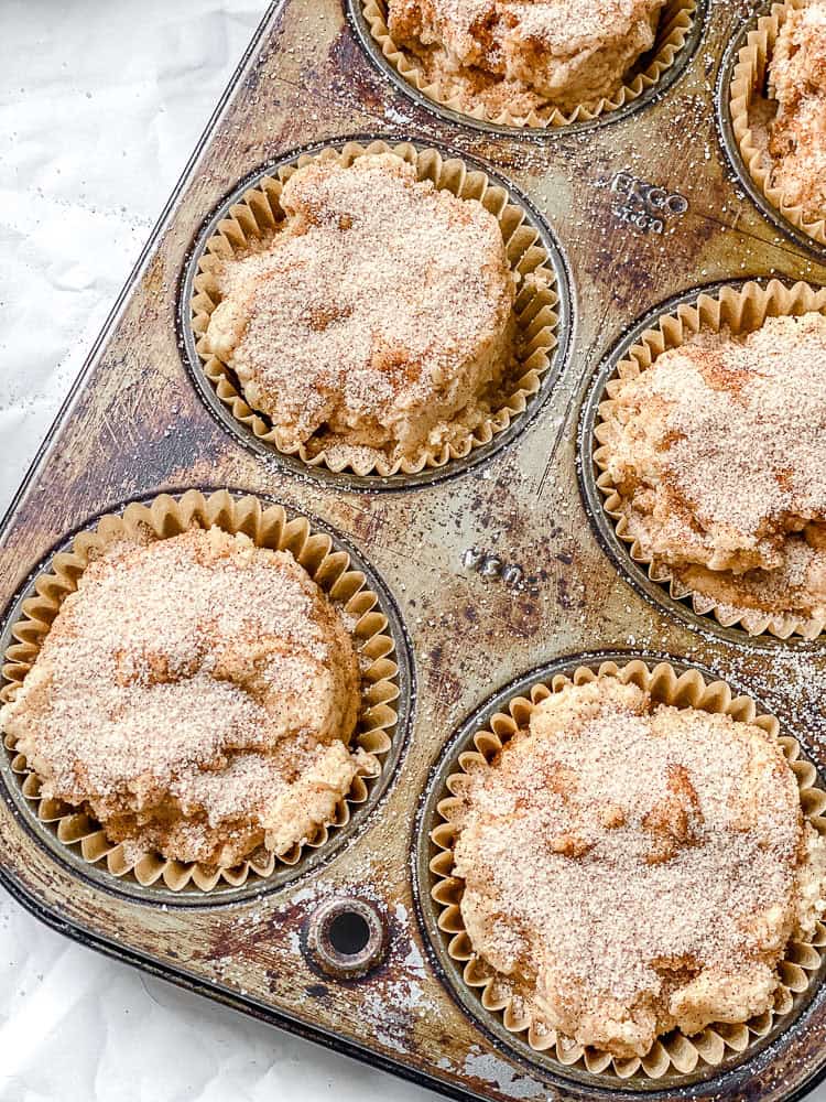 process shot showing pre-baked Easy Cinnamon Muffins in a muffin tin