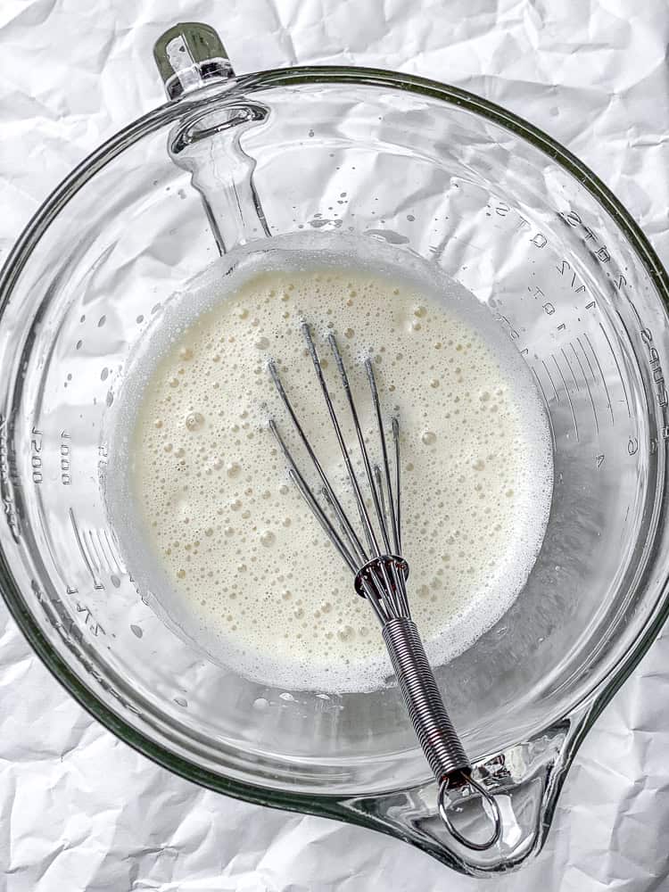 process shot showing whisking wet ingredients together in bowl