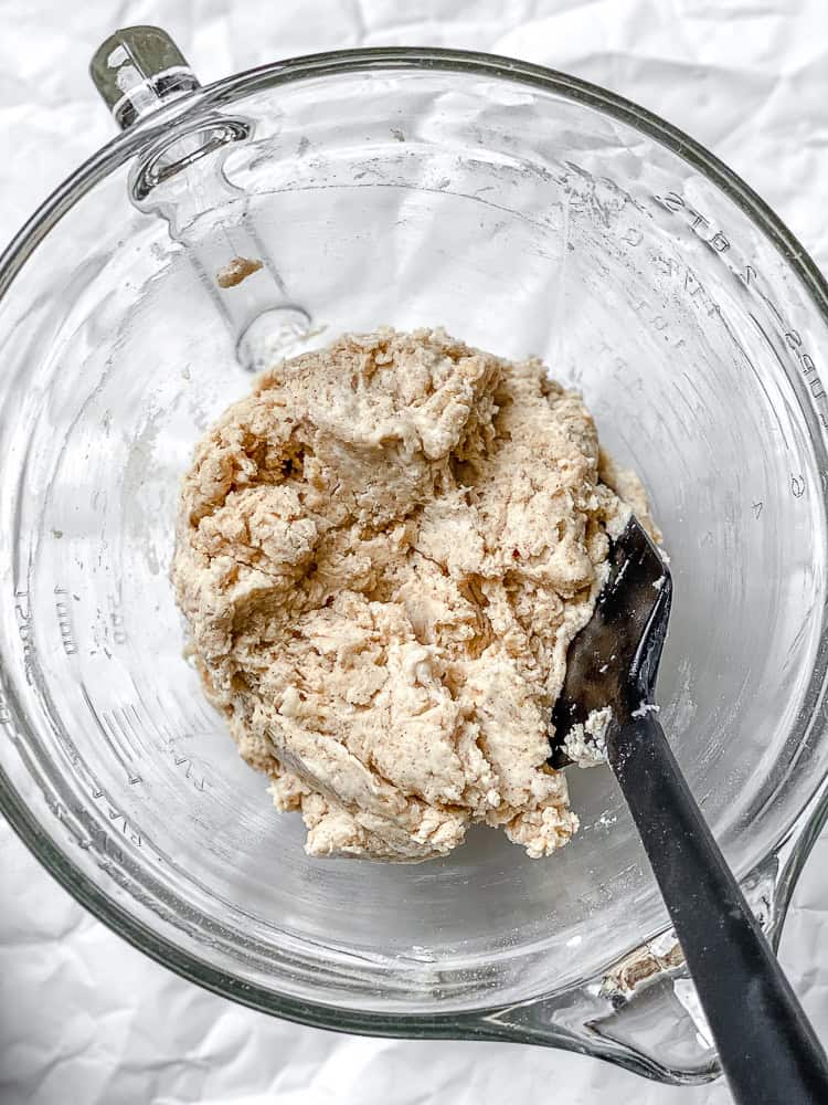 process shot showing mixing muffin batter in bowl