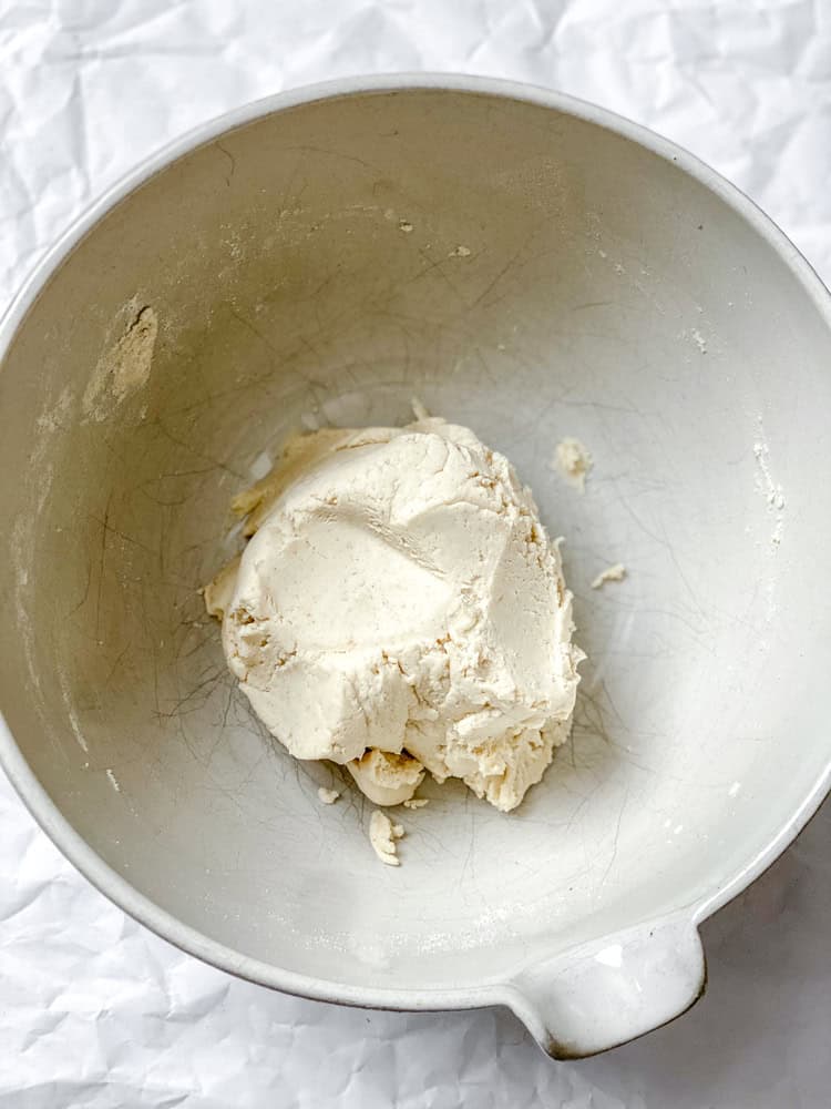 process shot showing dough formed in bowl