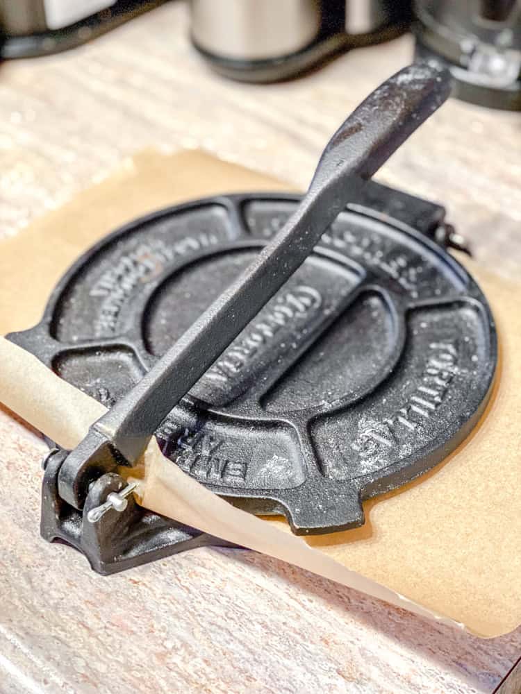 process shot showing tortillas being pressed