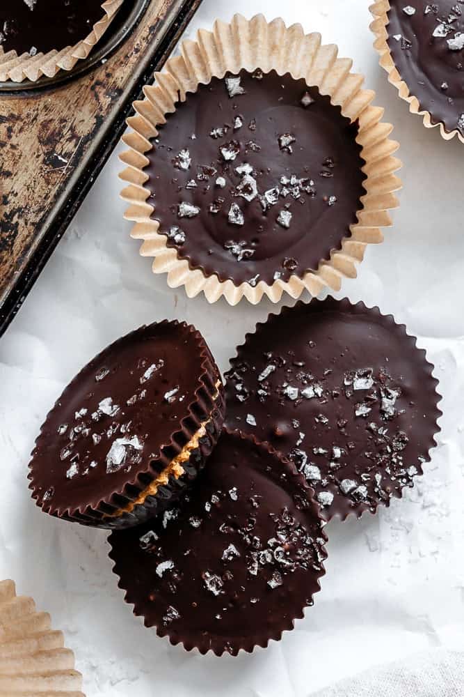 Completed Vegan Peanut Butter Cups on a white surface.