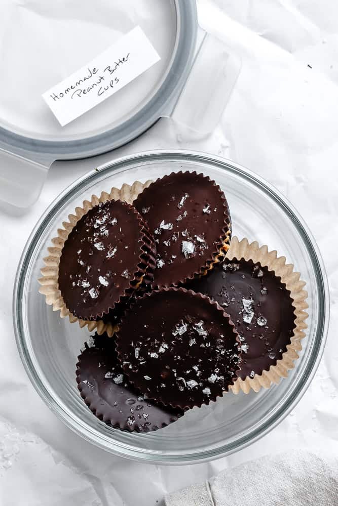 Completed Vegan Peanut Butter Cups on a white surface in a bowl.
