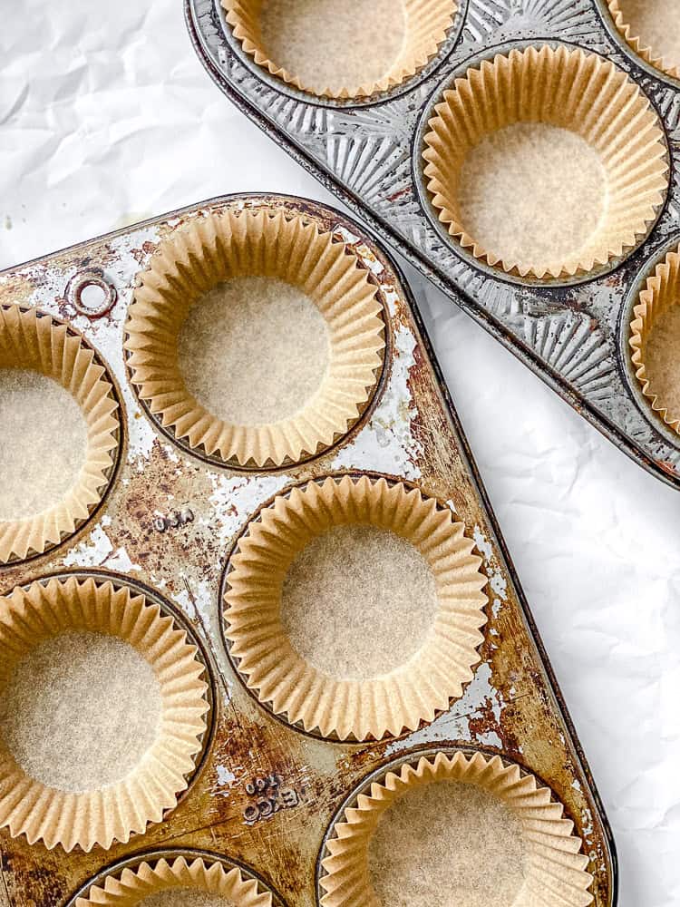 process shot showing muffin tin lined with liners
