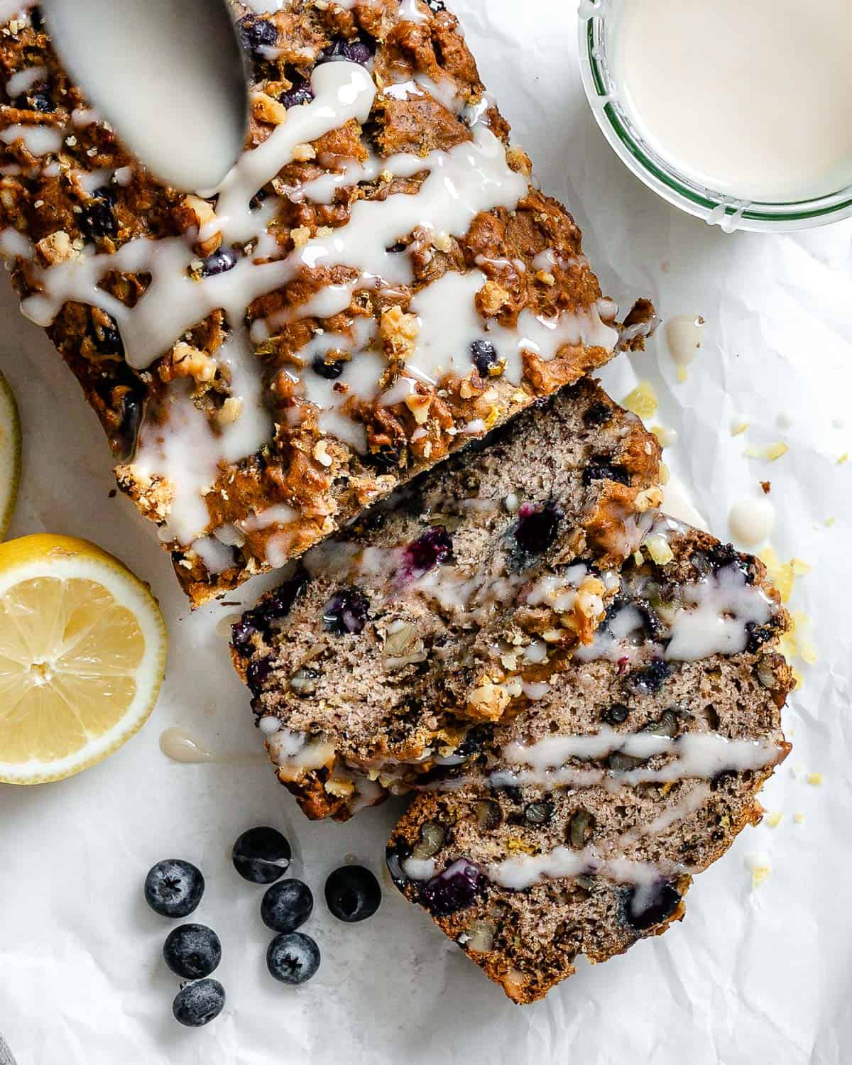 completed Vegan Lemon Blueberry Loaf on a white surface