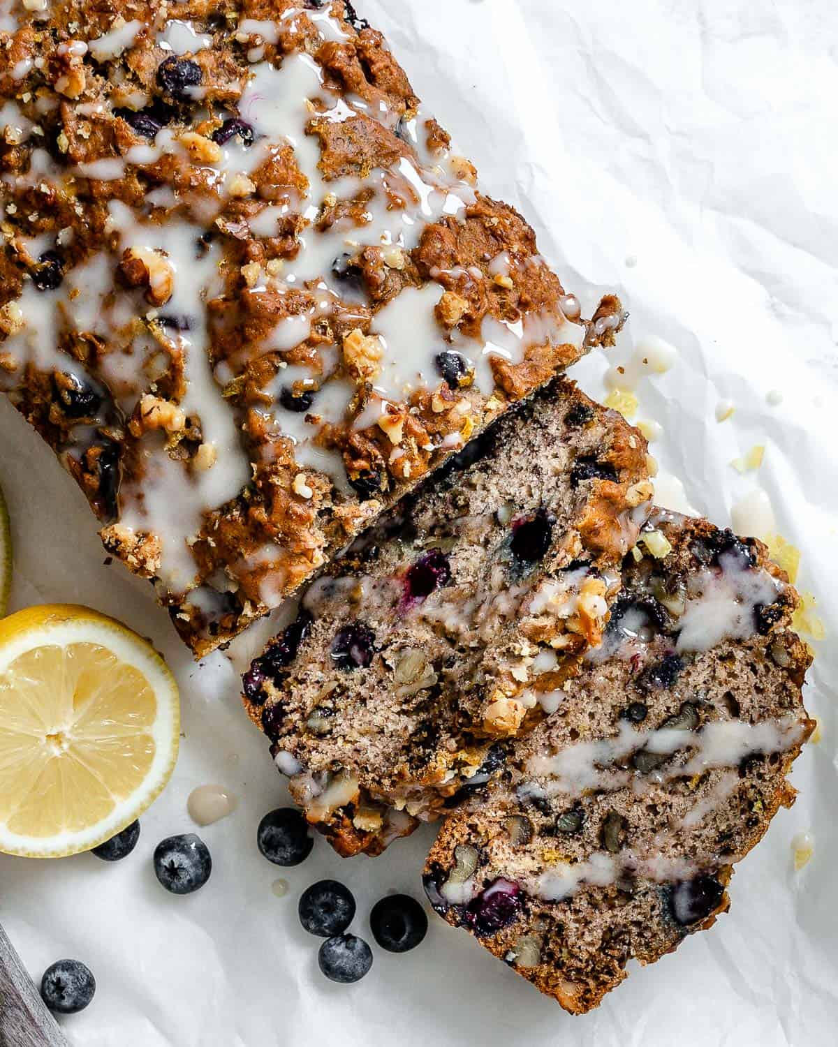 completed Vegan Lemon Blueberry Loaf on a white surface