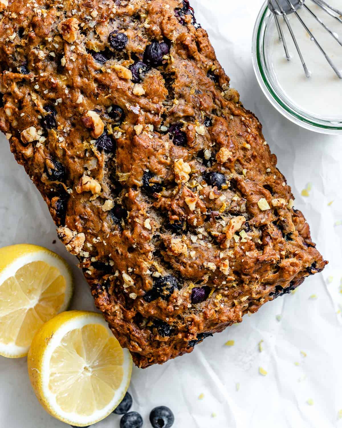 completed Vegan Lemon Blueberry Loaf on a white surface