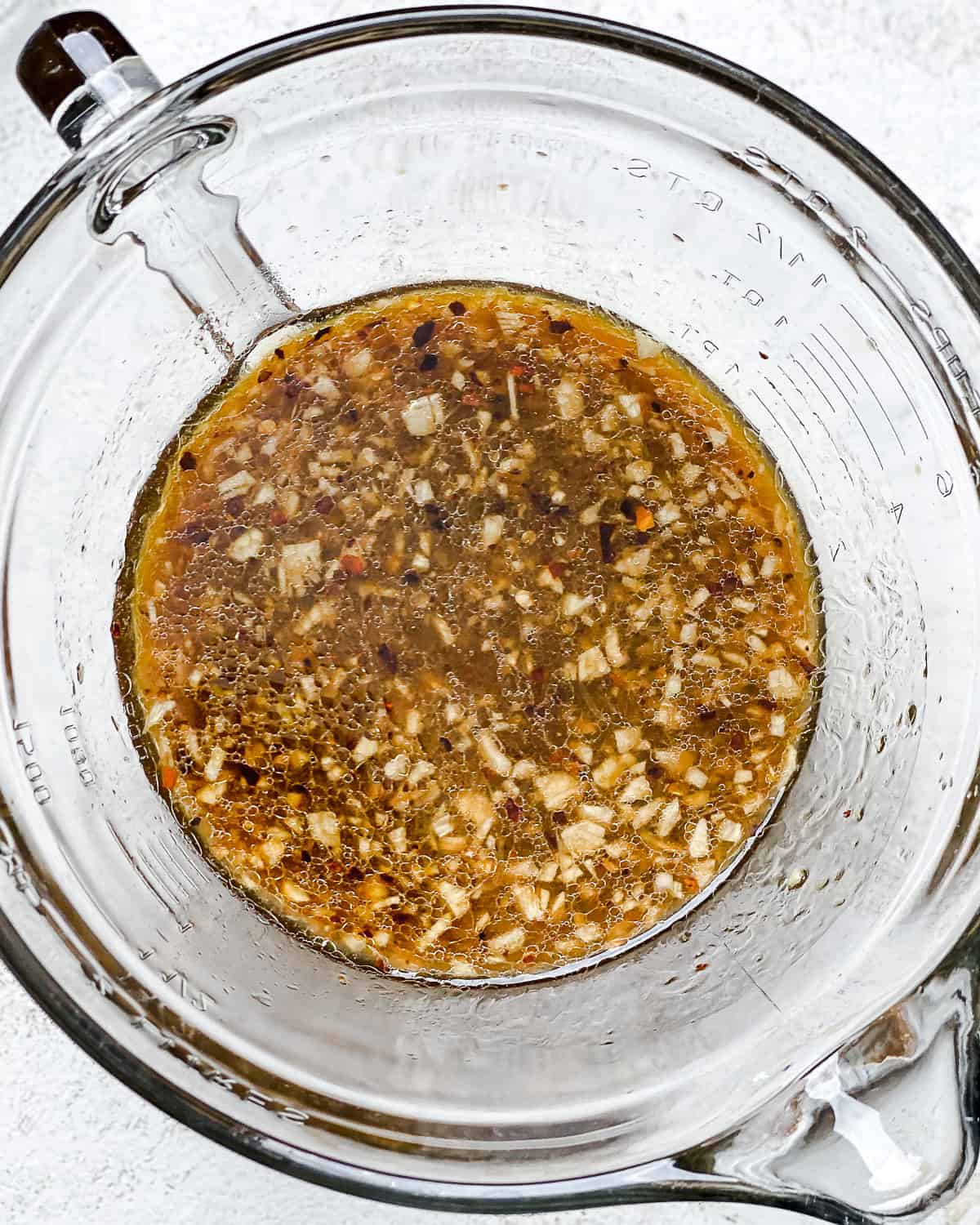 process shot showing marinade in glass bowl