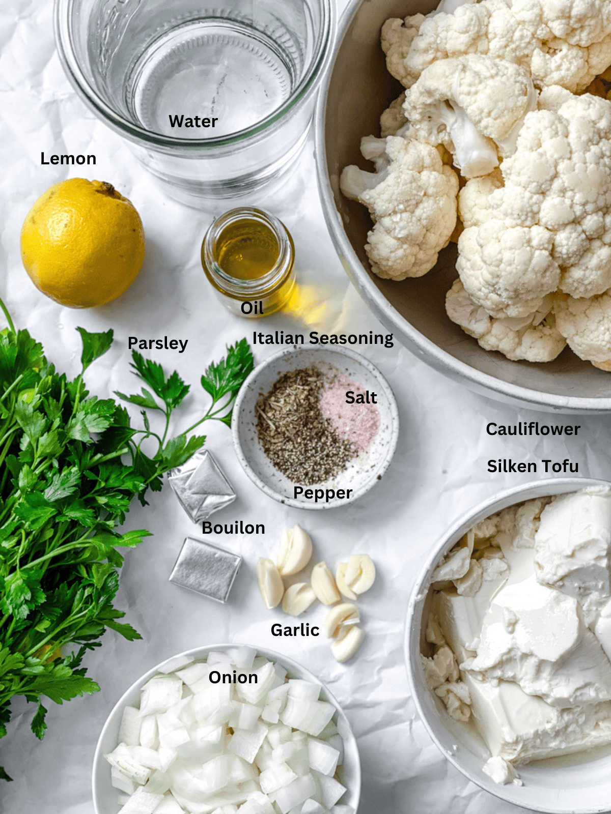 ingredients for Roasted Cauliflower Soup measured out on a white surface