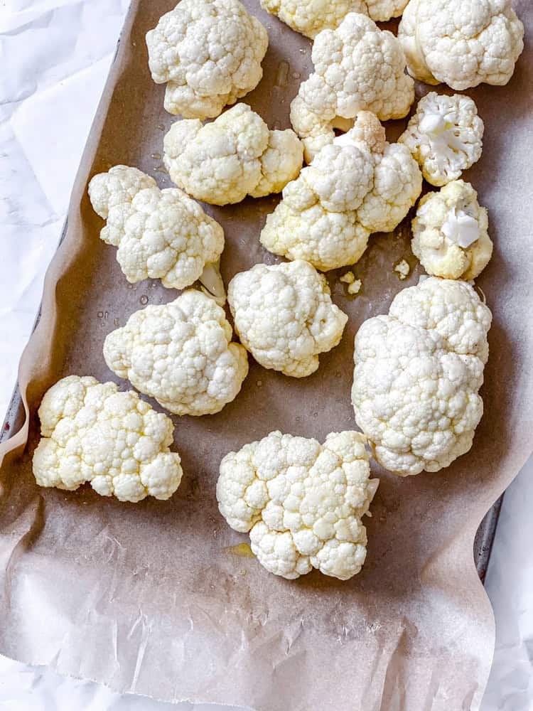 process shot showing cauliflower on baking sheet