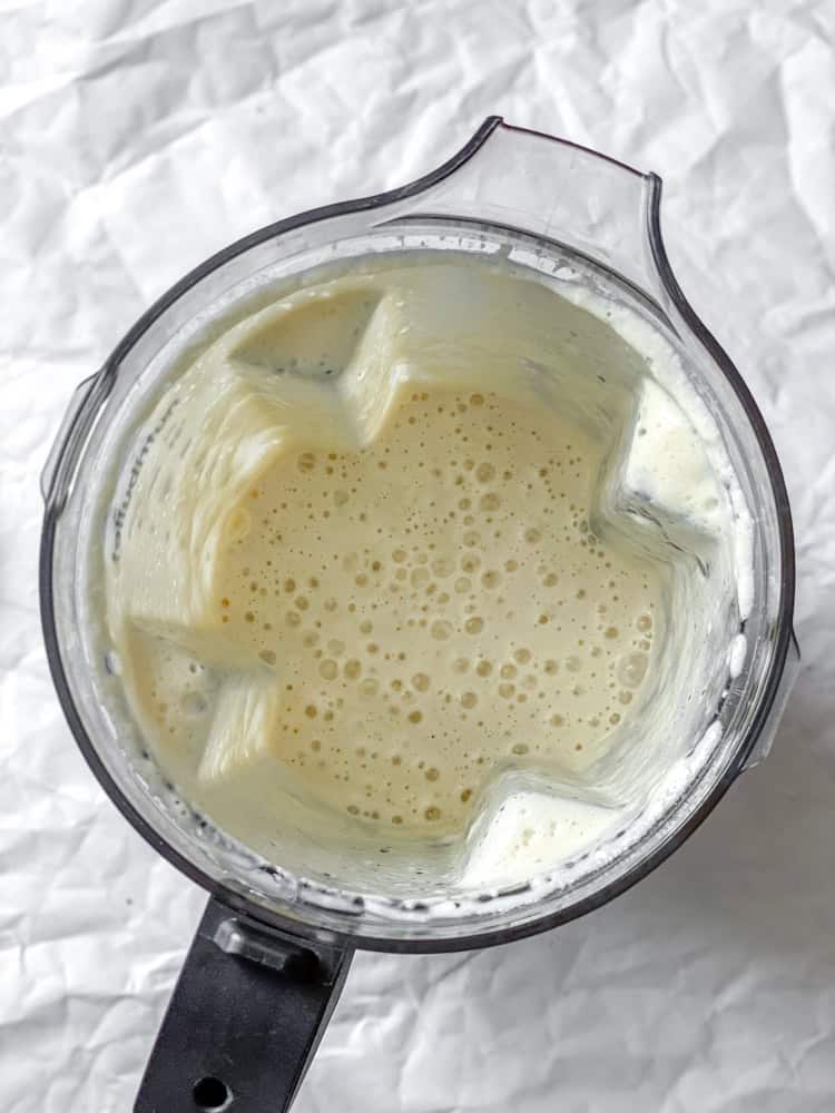 process shot showing blended ingredients in blender