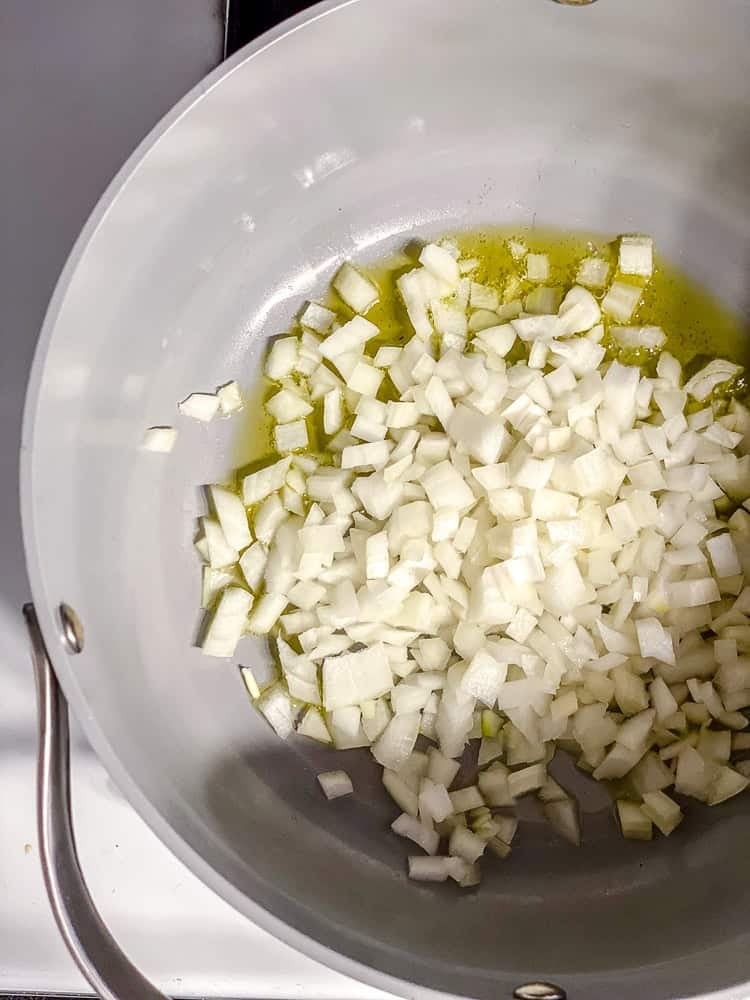 process shot showing onions cooking in pan
