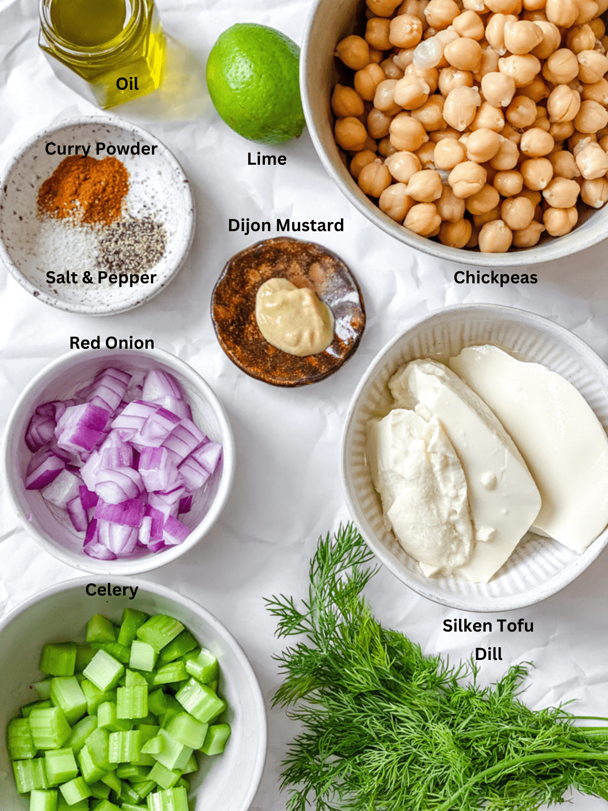 ingredients for Easy Curried Chickpea Salad measured out on a white surface