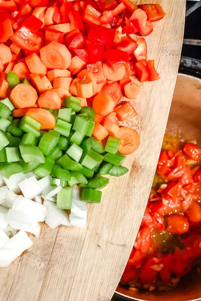 process shot of adding veggies to pot
