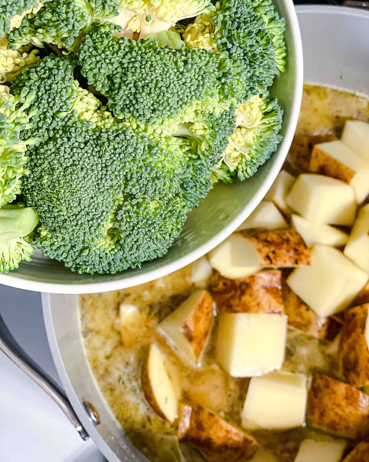 process shot showing adding broccoli to pot