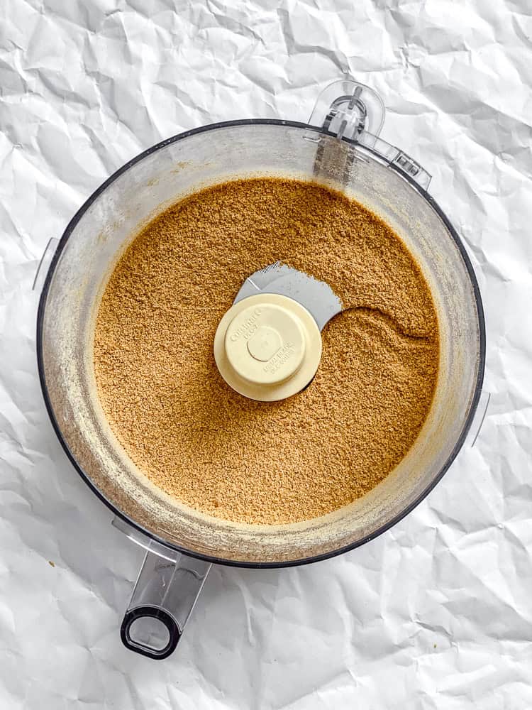 Process shot showing post processed graham crackers in food processor.