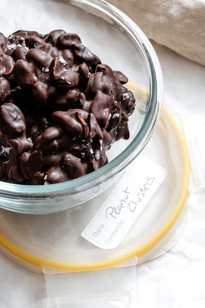 Completed Peanut Clusters in a storage container.