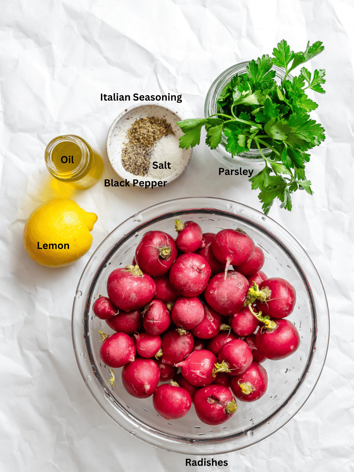 Ingredients for Roasted Radishes measured out on a white surface.