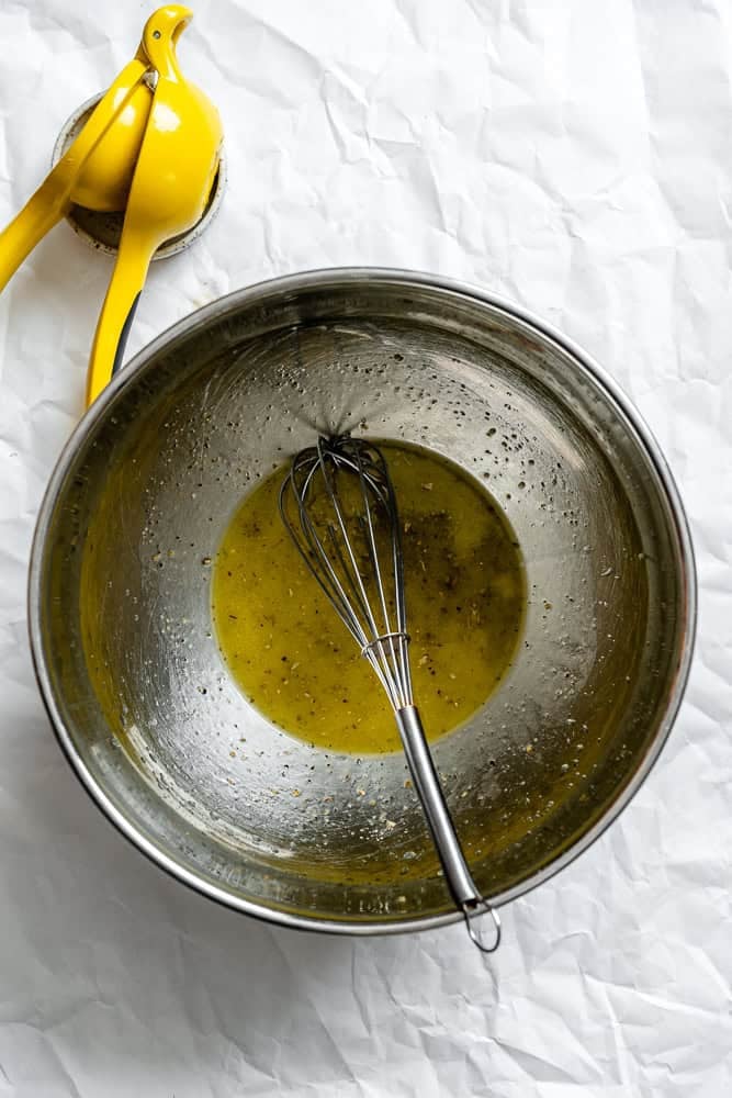 Process shot showing whisking ingredients in a bowl.
