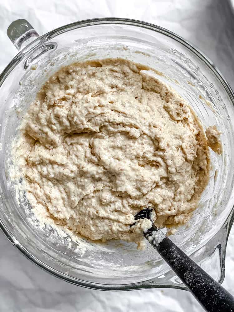 Process shot showing mixing batter in a bowl.