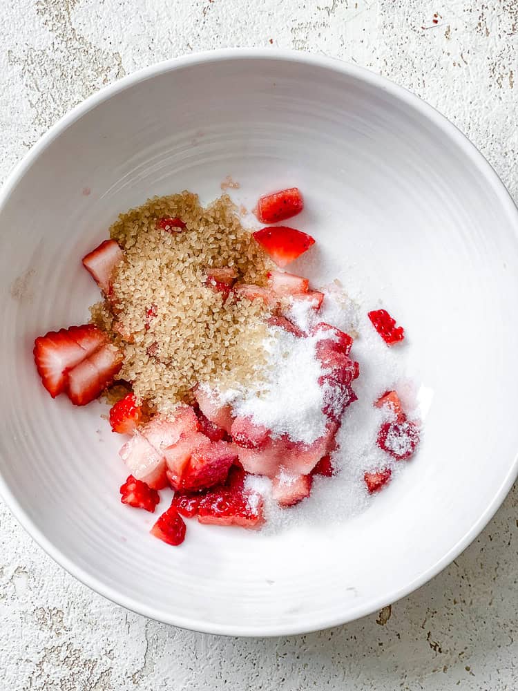 Process shot showing topping ingredients in bowl.