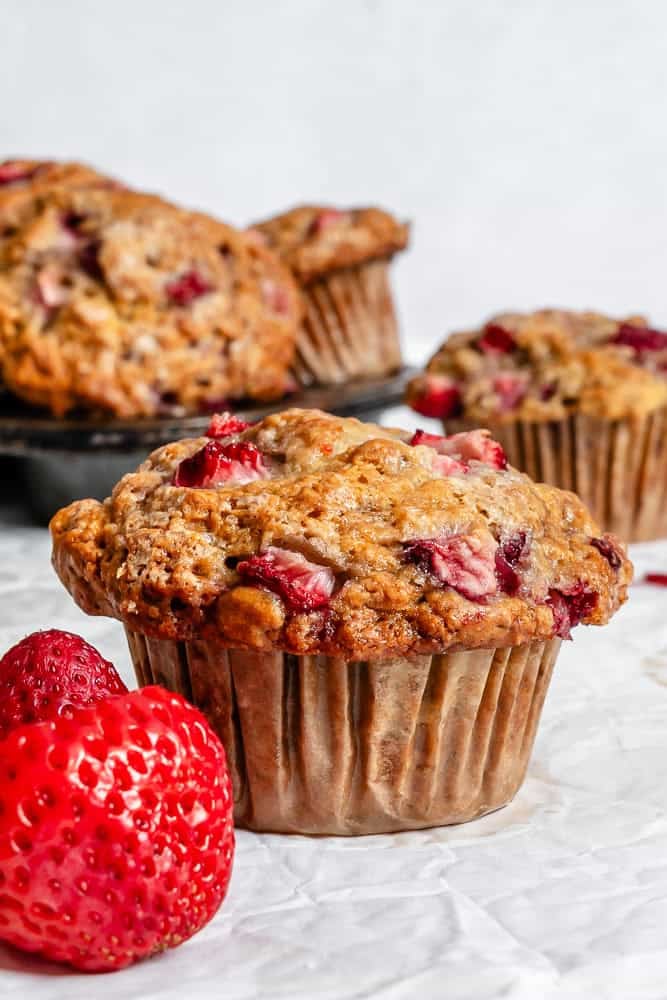 Completed Strawberry Banana Muffins (Egg-Free) against a white surface.