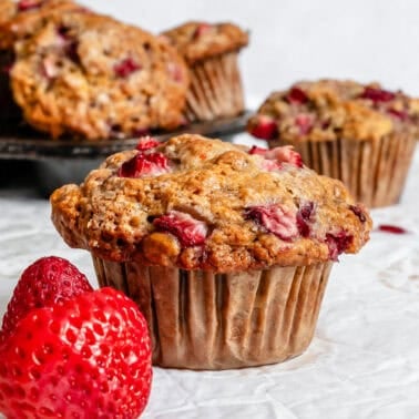 Completed Strawberry Banana Muffins (Egg-Free) against a white surface.
