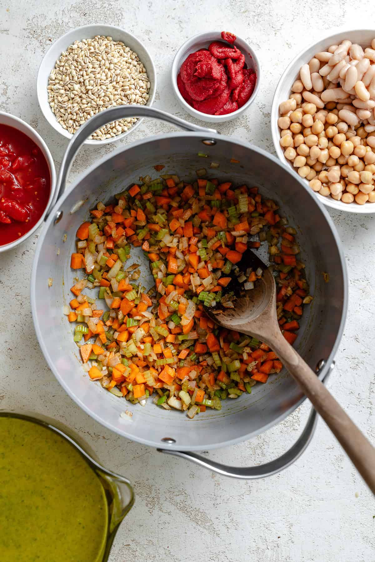 Process shot showing stirring ingredients in a pot.
