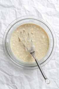 Process shot showing stirring ingredients in bowl.